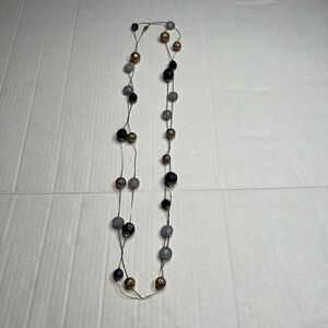 Gold tone long beaded and stone necklace